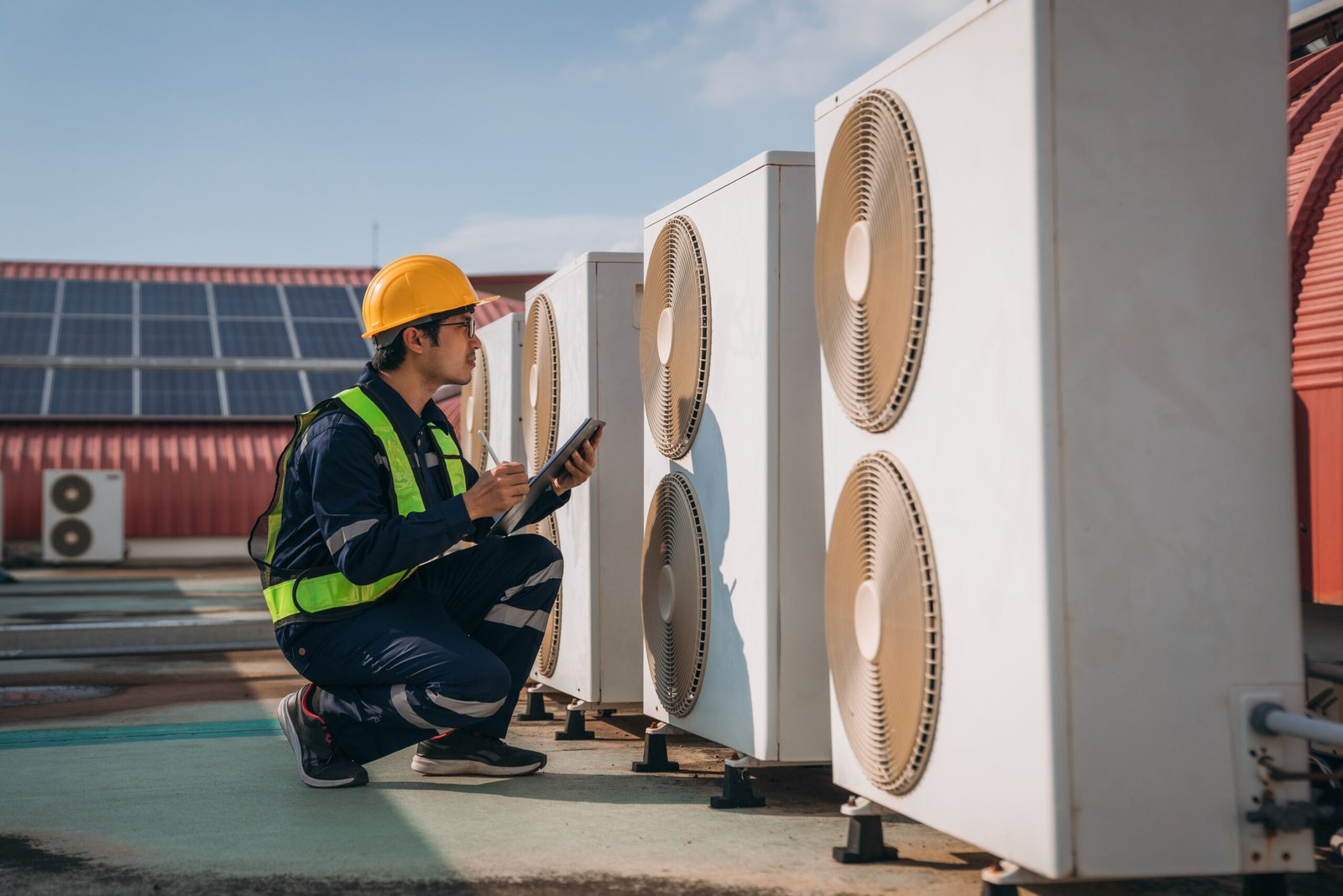 engineers-is-checking-the-air-conditioning-cooling-2023-11-27-04-57-38-utc-scaled.jpg